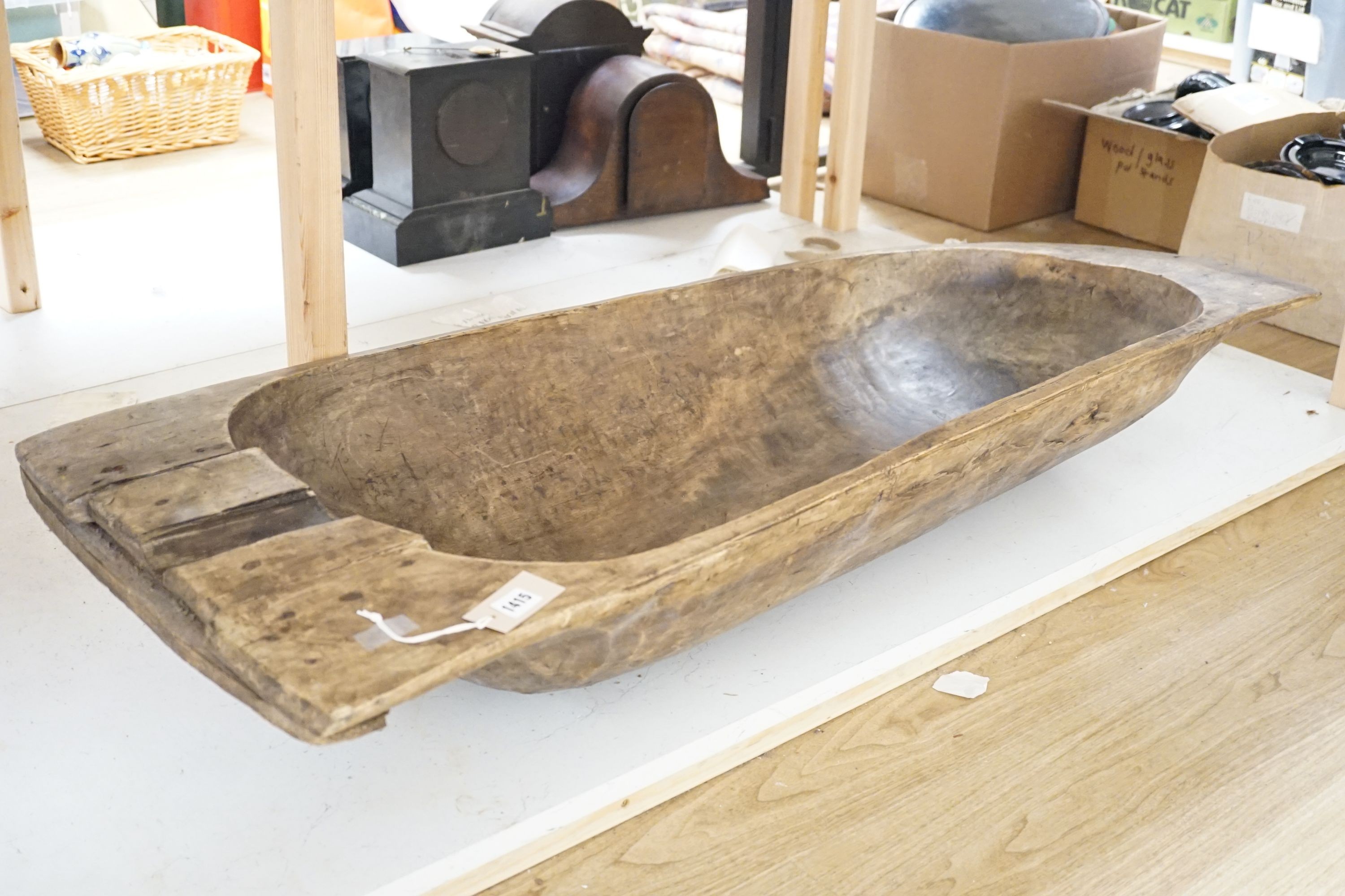 A large 19th century European fruitwood dough trough hewn from a single piece of wood. 132cm x 49cm. *This lot is being sold in aid of the charity Dogs Trust UK with 100% of the hammer price going to the charity